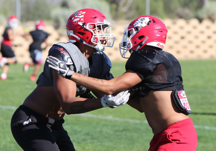 Paki Finau (left) taking on a defender at practice.